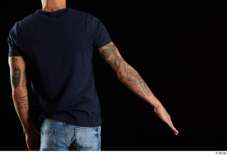 Claudio  1 arm back view blue t shirt clothing…